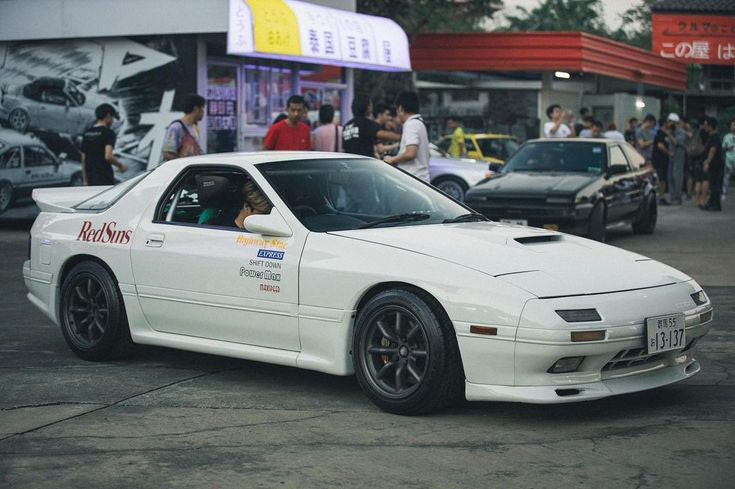 13-137 license plate on the white Mazda RX-7 from Japanese Manga Initial D 